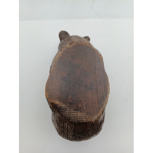 301 - A hand carved black forest bear from the Swiss or German regions of the black forest. Height 3 inche... 