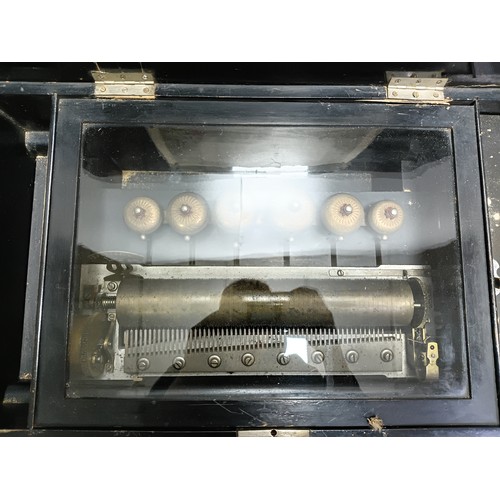 202 - Late 19th/early 20th century cylinder musical box in a rectangular ebonised and walnut-veneered case... 