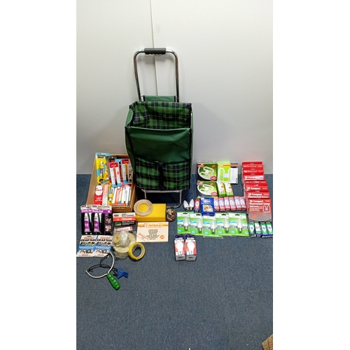 7 - A group of household and DIY sundries including a plaid folding shopping trolley, boxed LED and comp... 