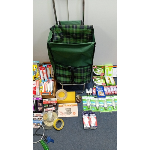 7 - A group of household and DIY sundries including a plaid folding shopping trolley, boxed LED and comp... 