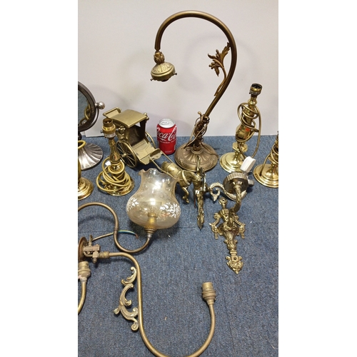 13 - A group of brass and gilt-metal lighting fittings comprising table lamps, wall sconces and ceiling c... 