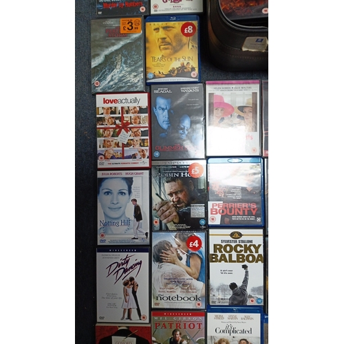 15 - A quantity of commercial DVD and Blu-ray films in original cases, including romance, action, and dra... 