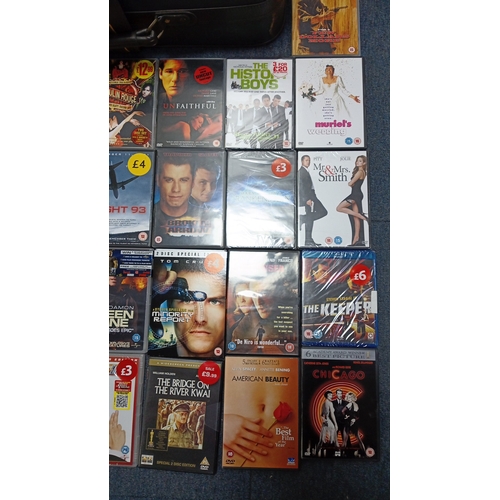 15 - A quantity of commercial DVD and Blu-ray films in original cases, including romance, action, and dra... 