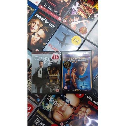 15 - A quantity of commercial DVD and Blu-ray films in original cases, including romance, action, and dra... 