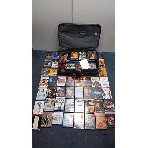 15 - A quantity of commercial DVD and Blu-ray films in original cases, including romance, action, and dra... 