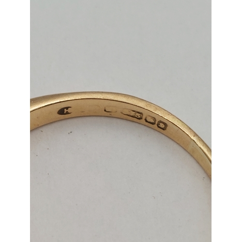 393 - A hallmarked 375 9ct gold ring set with diamonds and sapphires. One missing. Size P