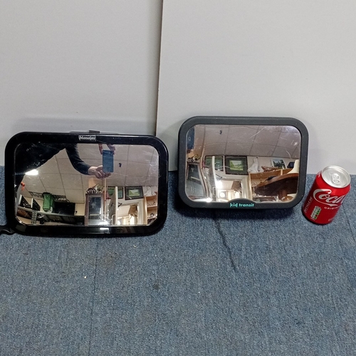 16 - A pair of moulded plastic in-car safety mirrors, Monojoy and Kid Transit, each with adjustable webbi... 