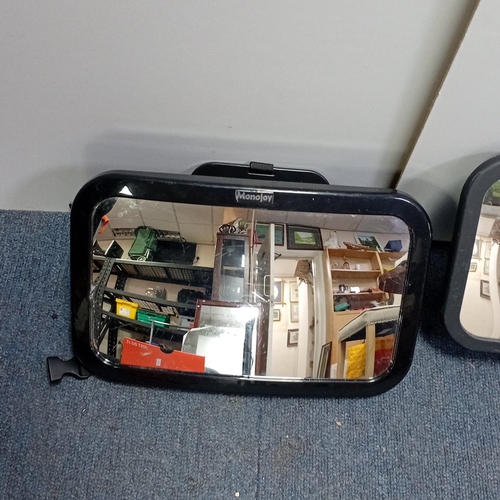 16 - A pair of moulded plastic in-car safety mirrors, Monojoy and Kid Transit, each with adjustable webbi... 