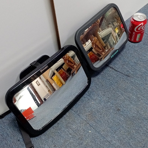 16 - A pair of moulded plastic in-car safety mirrors, Monojoy and Kid Transit, each with adjustable webbi... 