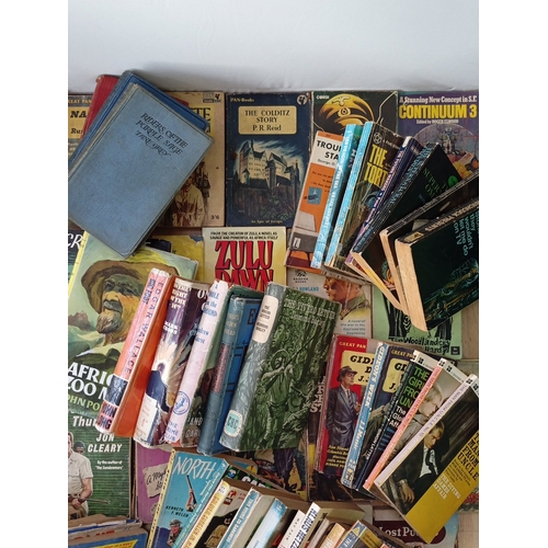 19 - A quantity of 20th-century paperback and hardback books, largely popular fiction and genre titles, i... 