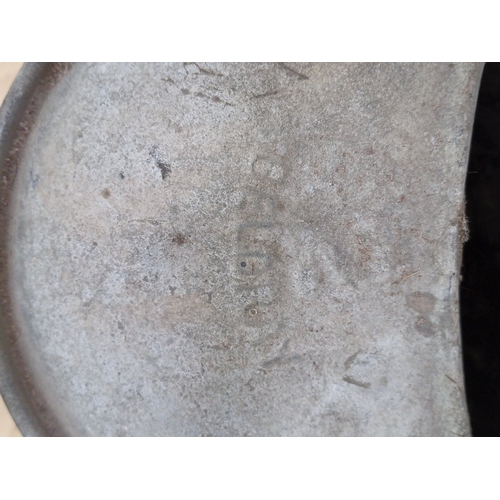 20 - A group of two garden watering vessels: a black-painted metal watering can with domed cover and hand... 