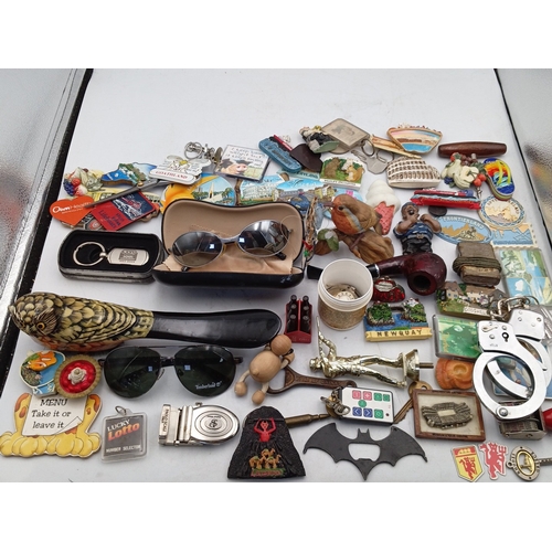 24 - A quantity of assorted novelty souvenirs and small collectibles, including resin and enamel fridge m... 