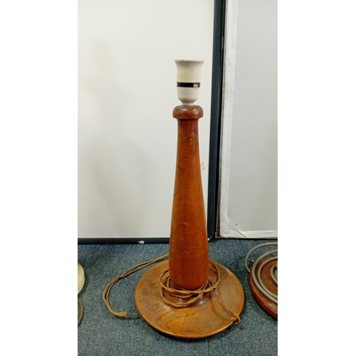 31 - A group of three table lamps, 20th century—one of baluster form in banded onyx with brass lampholder... 