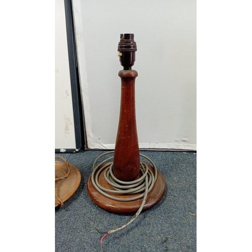31 - A group of three table lamps, 20th century—one of baluster form in banded onyx with brass lampholder... 
