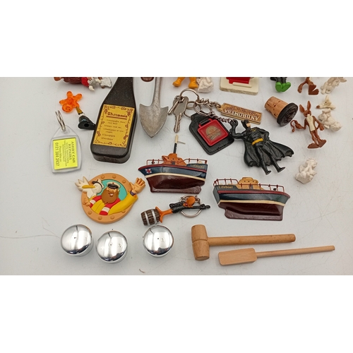 32 - An assortment of small collectibles and novelties, including a Simpsons metal tin, character figures... 