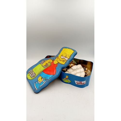 32 - An assortment of small collectibles and novelties, including a Simpsons metal tin, character figures... 