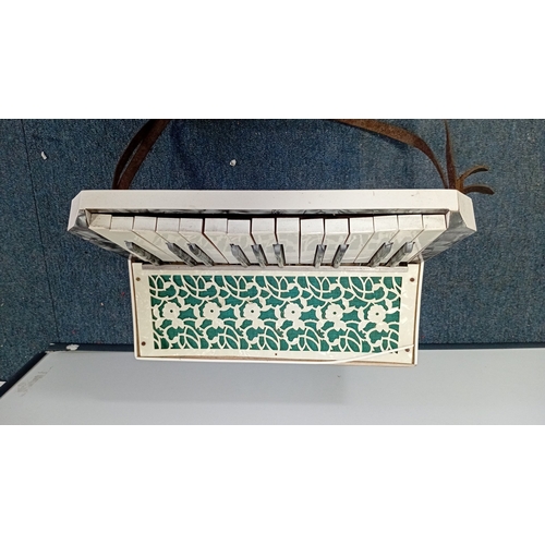 35 - Francesco ‘Modello’ piano accordion, mid-20th century—grey marbled case with red floral decoration, ... 