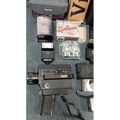 37 - A group of late 20th century photographic and cine equipment, including an Elmo Super 8 Sound cine c... 