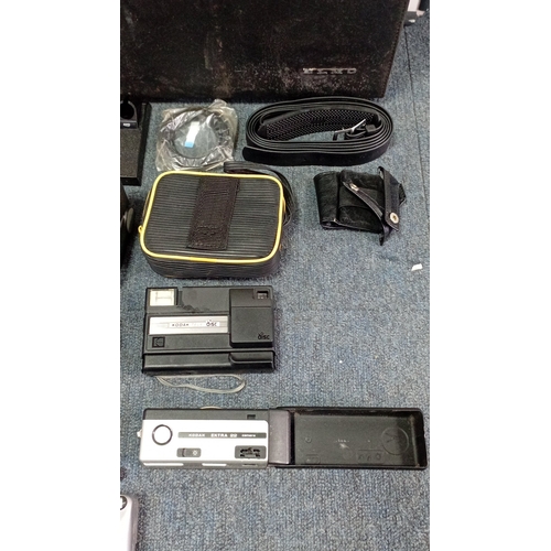 37 - A group of late 20th century photographic and cine equipment, including an Elmo Super 8 Sound cine c... 