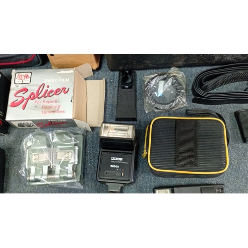 37 - A group of late 20th century photographic and cine equipment, including an Elmo Super 8 Sound cine c... 