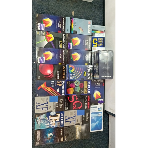 38 - A quantity of VHS blank videocassettes in original retail sleeves, including BASF, Memorex, Grundig,... 