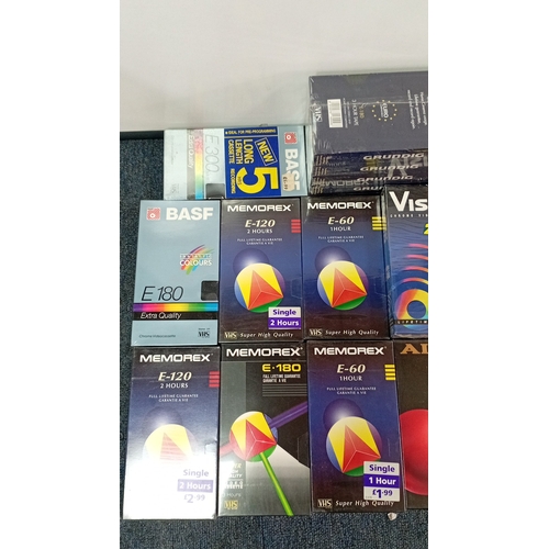 38 - A quantity of VHS blank videocassettes in original retail sleeves, including BASF, Memorex, Grundig,... 