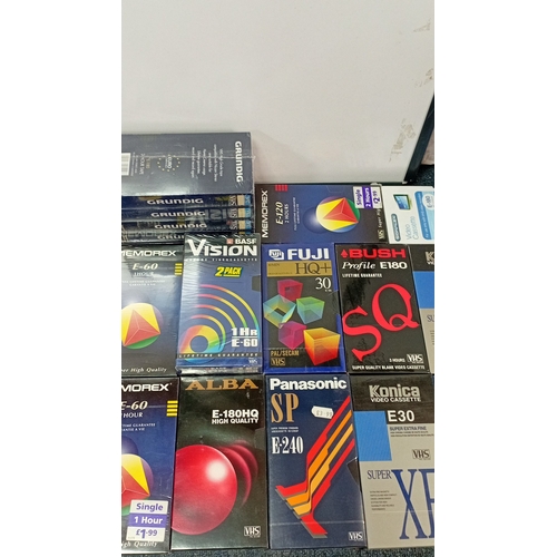 38 - A quantity of VHS blank videocassettes in original retail sleeves, including BASF, Memorex, Grundig,... 