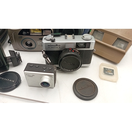 40 - A mixed group of photographic equipment including Fujifilm Instax 100 instant camera with box, Minol... 