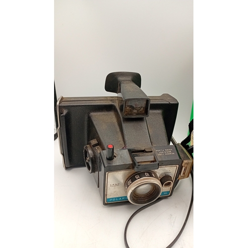 40 - A mixed group of photographic equipment including Fujifilm Instax 100 instant camera with box, Minol... 