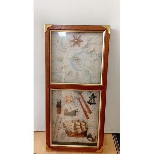 44 - Modern wall clock with applied maritime shadowbox panel beneath, both set against a printed chart ba... 
