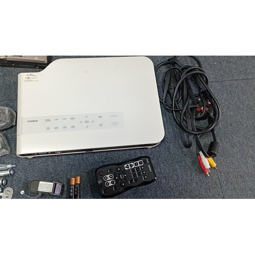 91 - A mixed group of consumer electronics including a Casio DLP projector with remote and cables, portab... 