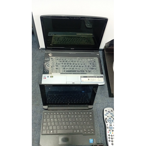93 - A mixed group of consumer electronics and accessories, including Acer and Lenovo laptop computers, a... 