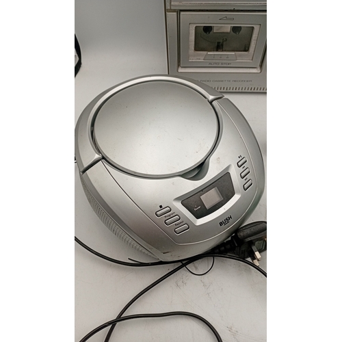 97 - A group of portable audio equipment comprising a Ferguson 3-band radio cassette recorder, model 3T21... 