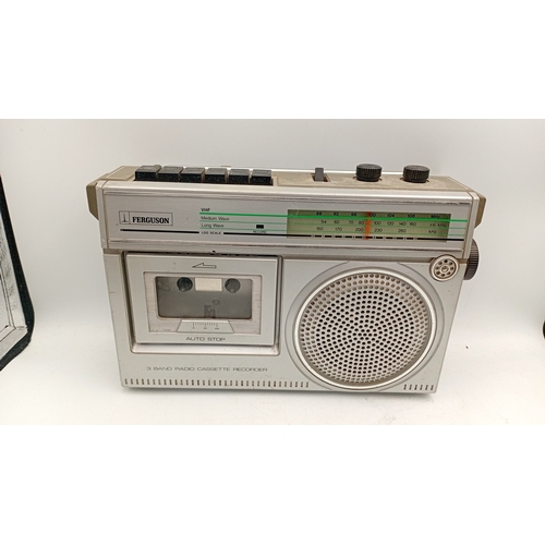 97 - A group of portable audio equipment comprising a Ferguson 3-band radio cassette recorder, model 3T21... 