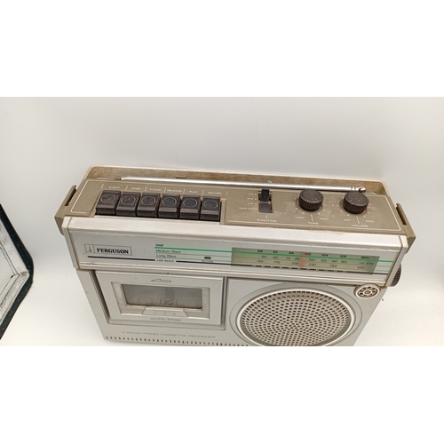 97 - A group of portable audio equipment comprising a Ferguson 3-band radio cassette recorder, model 3T21... 