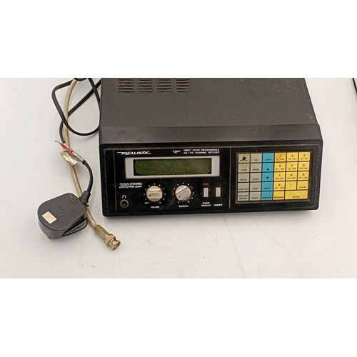 99 - Realistic PRO-2004 300-channel direct-entry programmable AM/FM scanning receiver, in a black metal c... 