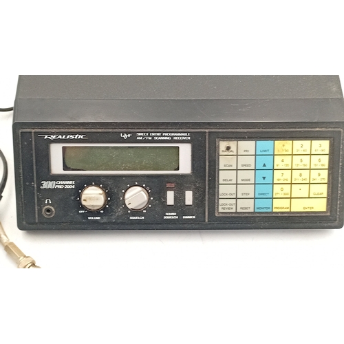 99 - Realistic PRO-2004 300-channel direct-entry programmable AM/FM scanning receiver, in a black metal c... 