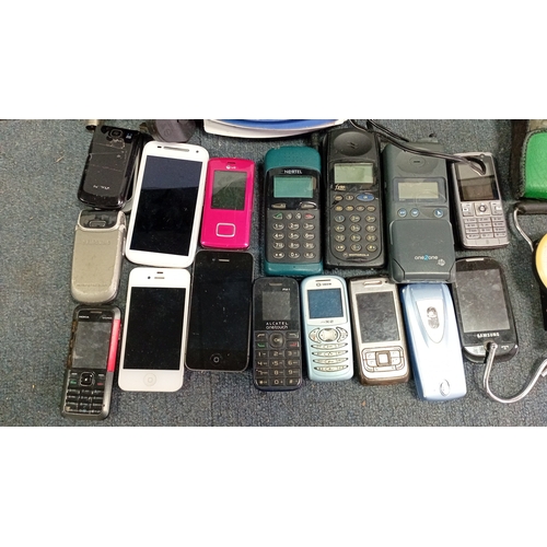 67 - A quantity of late 20th/early 21st century mobile telephones and telecommunications accessories, inc... 