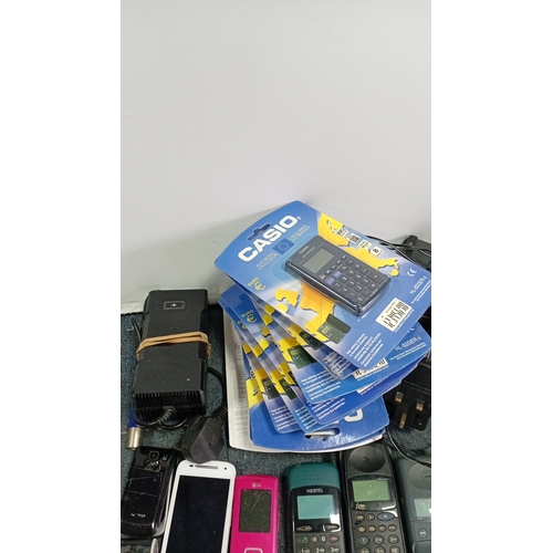 67 - A quantity of late 20th/early 21st century mobile telephones and telecommunications accessories, inc... 