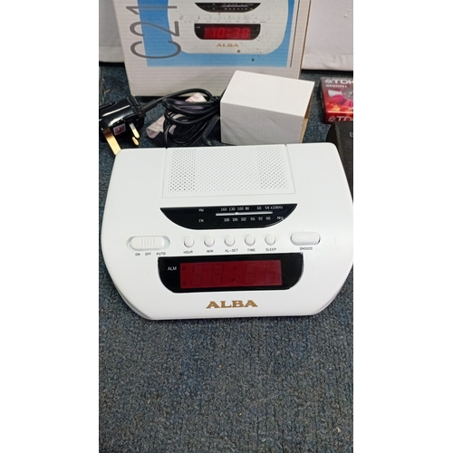 68 - A group of late 20th century personal audio equipment comprising an ALBA MW/FM clock radio with orig... 