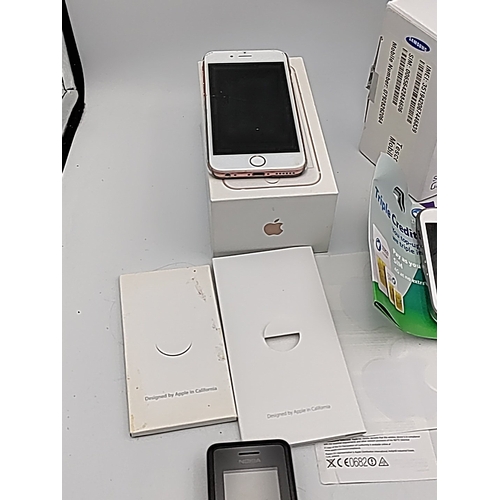 70 - A mixed group of mobile telephones including Apple iPhone 6s in box, Samsung Galaxy Young with Tesco... 