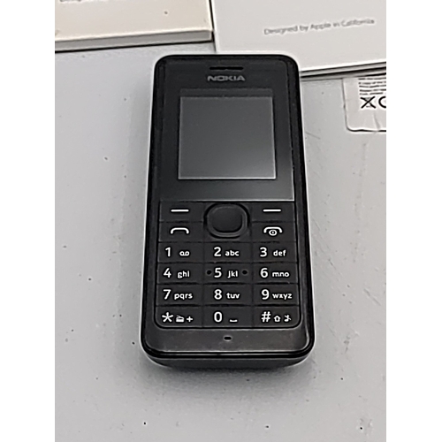 70 - A mixed group of mobile telephones including Apple iPhone 6s in box, Samsung Galaxy Young with Tesco... 