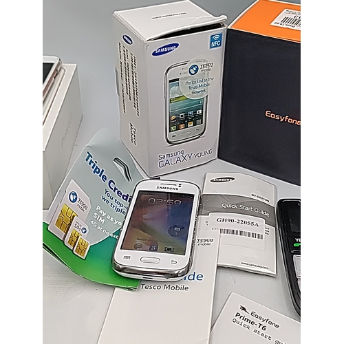 70 - A mixed group of mobile telephones including Apple iPhone 6s in box, Samsung Galaxy Young with Tesco... 