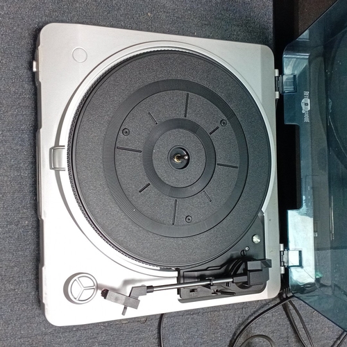 73 - A mixed group of domestic audio and household electronics, comprising two portable record players wi... 