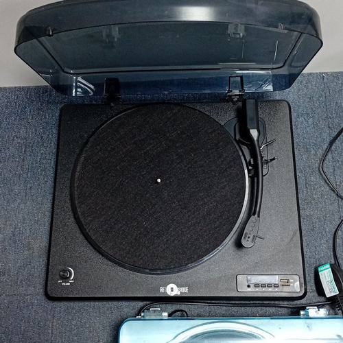 73 - A mixed group of domestic audio and household electronics, comprising two portable record players wi... 