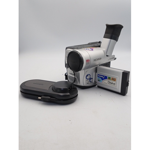 76 - A group of consumer photographic equipment comprising a Pentax Espio 145M Super 35mm compact camera;... 