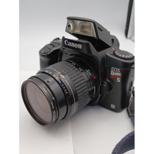 80 - Canon EOS Rebel S 35mm SLR camera with Canon EF 35–80mm zoom lens and integrated pop-up flash, accom... 