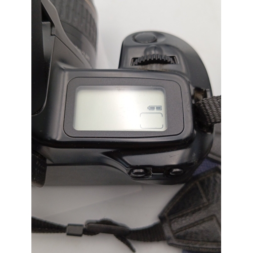 80 - Canon EOS Rebel S 35mm SLR camera with Canon EF 35–80mm zoom lens and integrated pop-up flash, accom... 