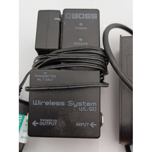 81 - A group of guitar effects and accessories comprising a Boss Wireless System WL-50 receiver with tran... 