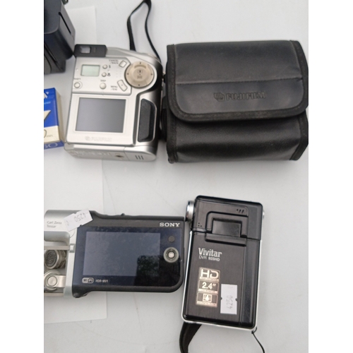 82 - A quantity of consumer digital video cameras, including a JVC MiniDV camcorder (GR-D290/GR-D270), a ... 